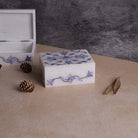 Luxury blue marble jewelry box with elegant detailing

