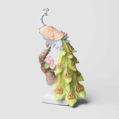 Majestic peacock figurine in vibrant sunrise colors

