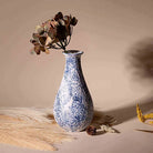 Midnight blue textured bottle vase with elegant finish

