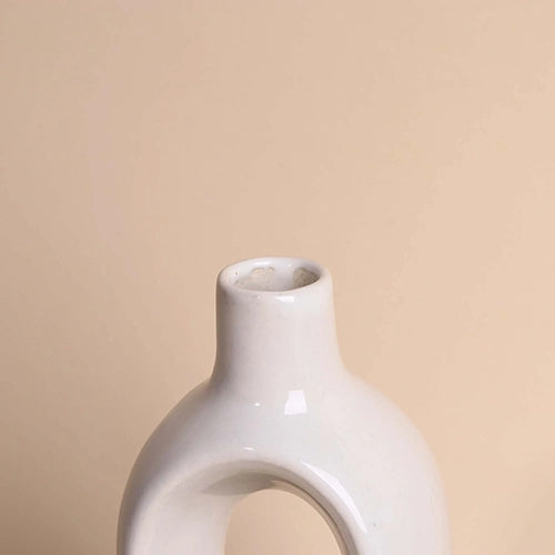Modern white hollow vase for stylish interior decoration

