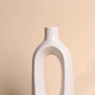 Sculptural white vase with a unique hollow design

