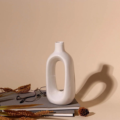 Contemporary hollow vase in a simple white finish

