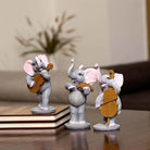Elephant trio figurines with musical instruments for tabletop decor


