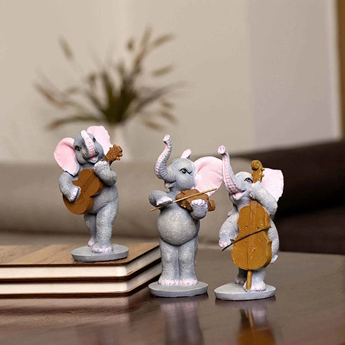 Elephant trio figurines with musical instruments for tabletop decor

