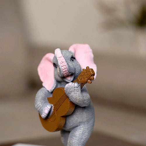 Artistic elephant trio sculptures with musical instruments

