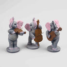 Decorative elephant trio with instruments for elegant home styling

