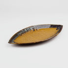 Mustard yellow ceramic platter with leaf lace design

