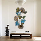 Decorative metal wall art featuring graceful natural elements

