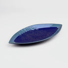 Navy ceramic platter with floral lace design


