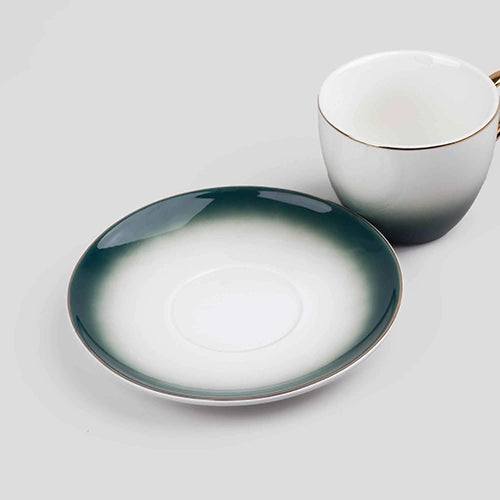 Opulent Gold Trim Cup and Saucer Set Styled for a Luxury Tea Experience