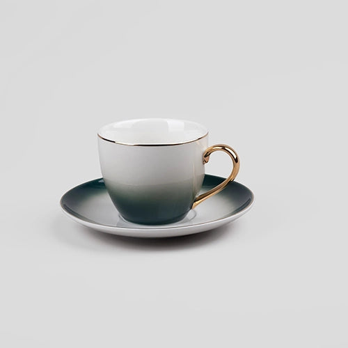 Four Gold Trim Cup and Saucer Sets Displayed on Open Kitchen Shelves