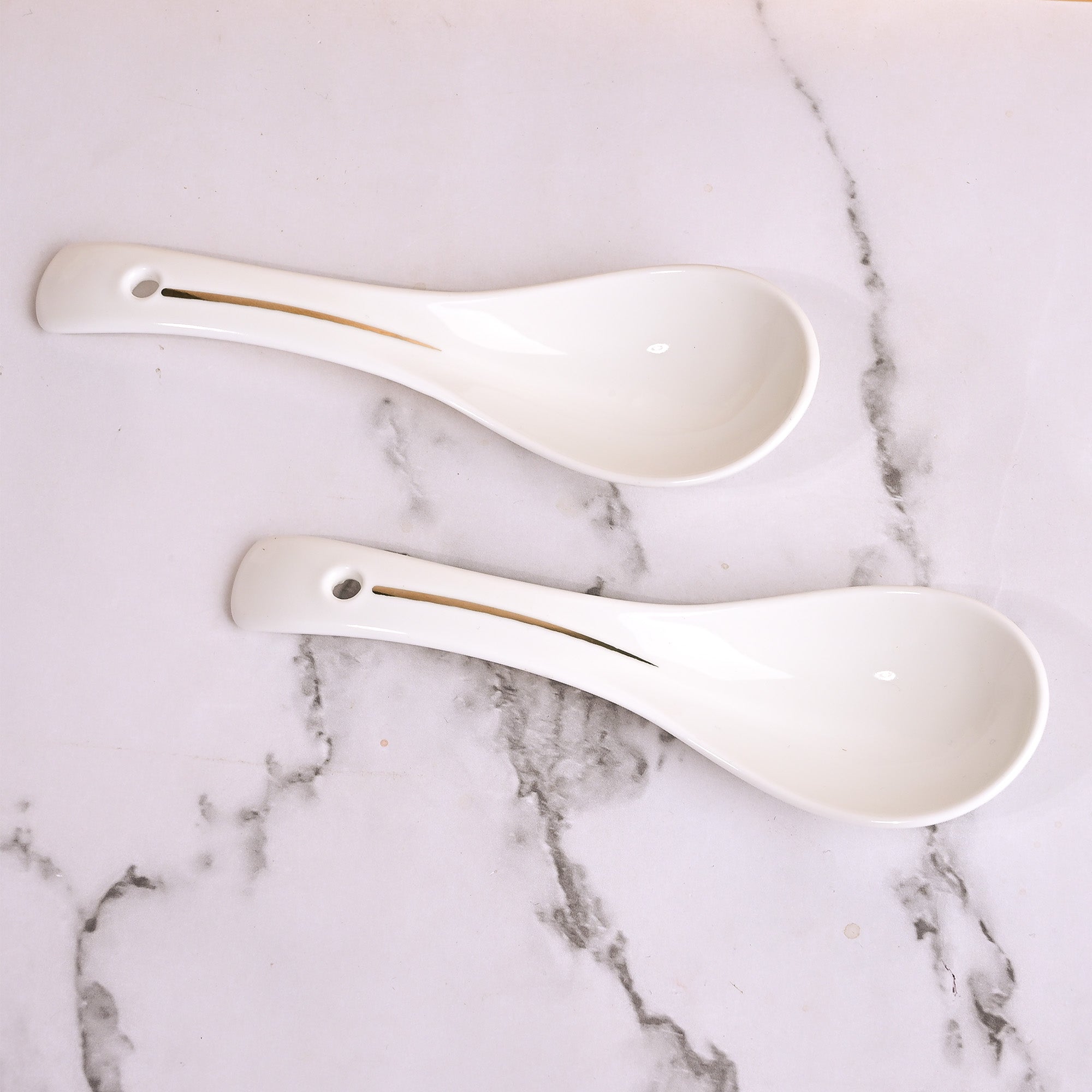 Opulent white bowl set with elegant saucers

