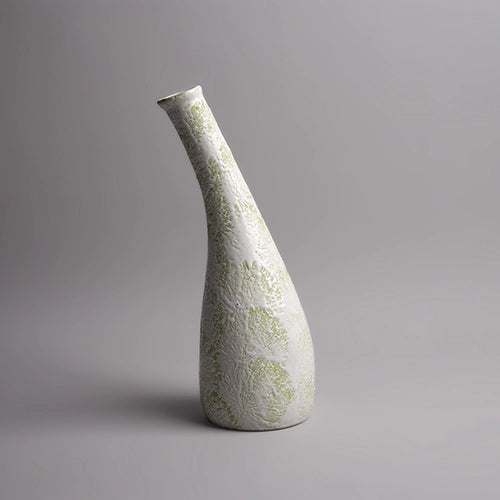 Decorative pastel green vase featuring a textured finish

