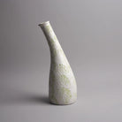 Decorative pastel green vase featuring a textured finish


