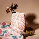 Modern peach vase featuring an embossed leaf pattern

