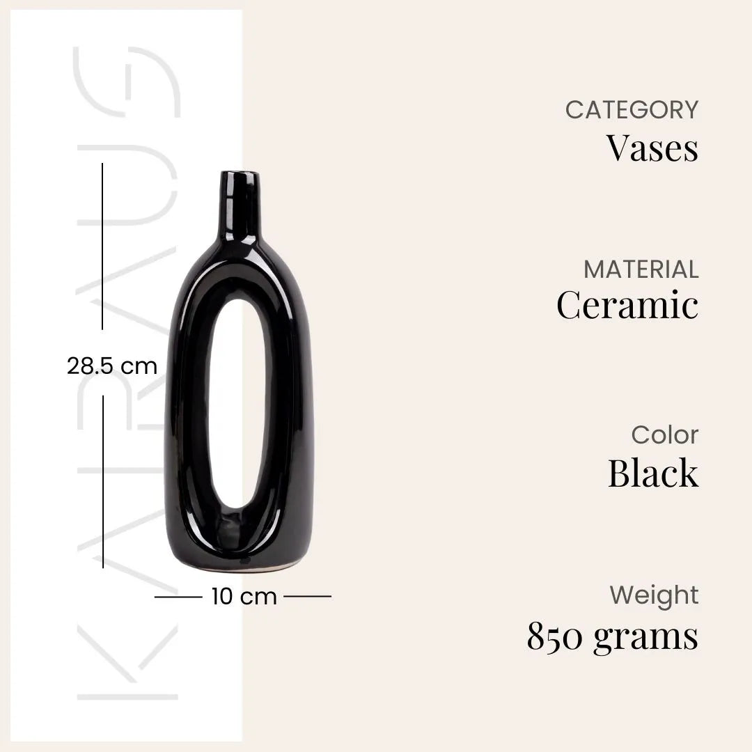 Decorative pitch black vase featuring a unique hollow shape


