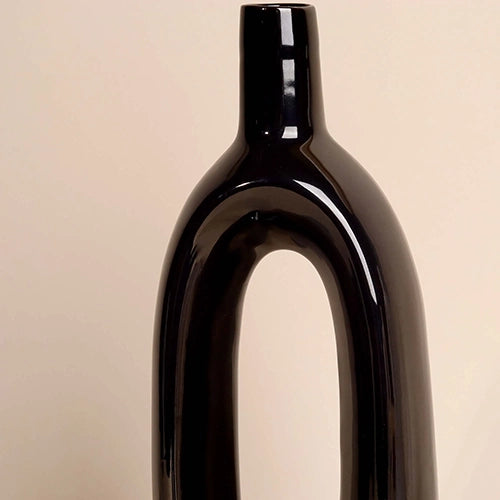 Minimalist pitch black sculptural vase for stylish interiors

