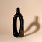 Artistic black hollow vase for living room decoration

