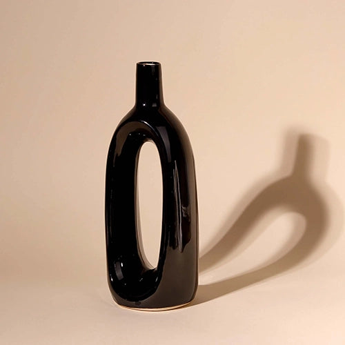Artistic black hollow vase for living room decoration

