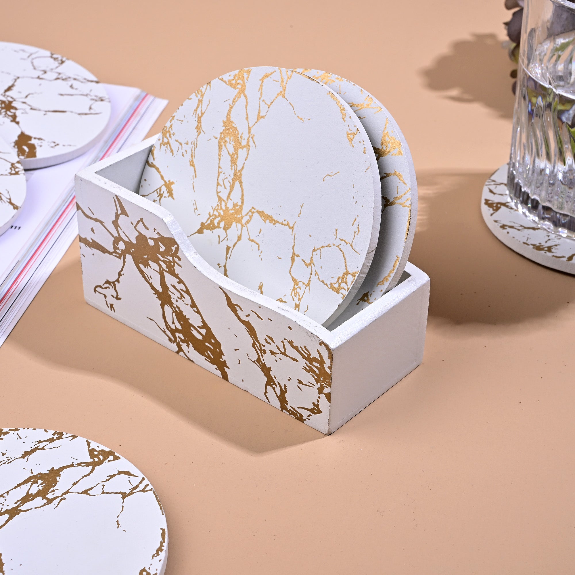White and gold wooden coasters arranged together


