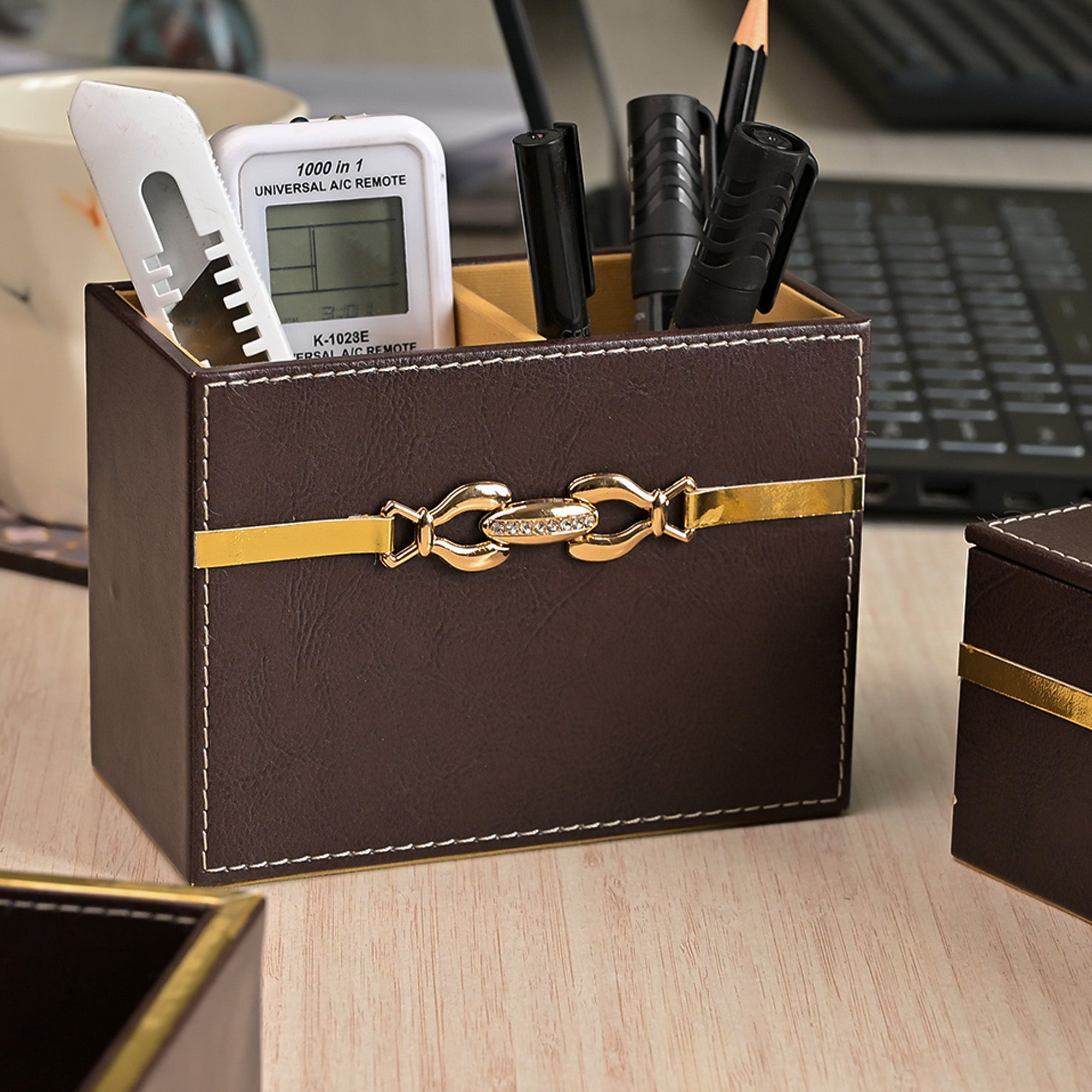 Decorative maroon leather desk accessory organiser


