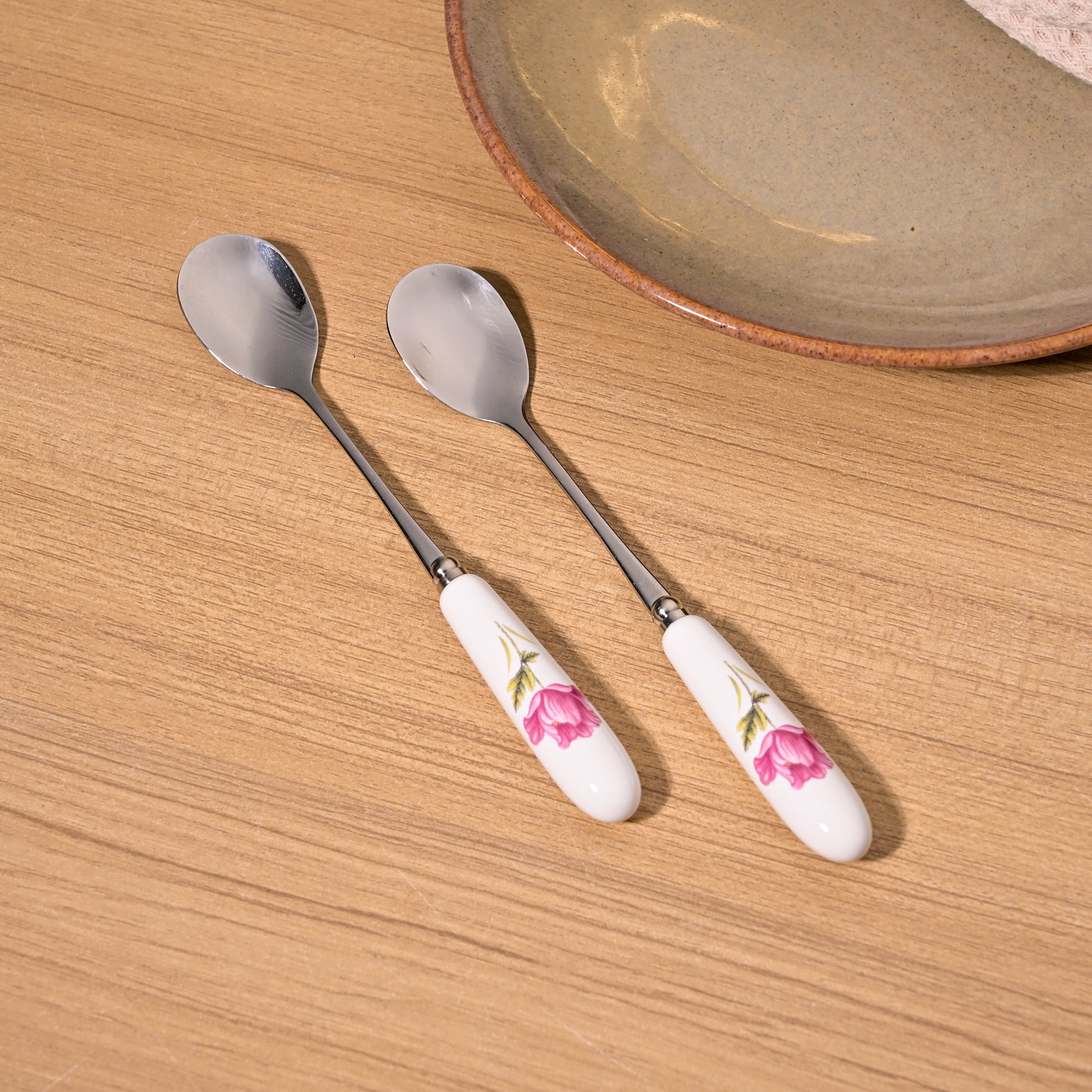 Radiant Rose Dessert Spoons Close-Up Showing Fine Details

