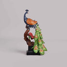 Artistic peacock figurine displayed as a home decor centerpiece

