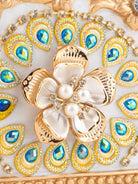 Close-up of ornate craftsmanship on a Royal European tissue holder


