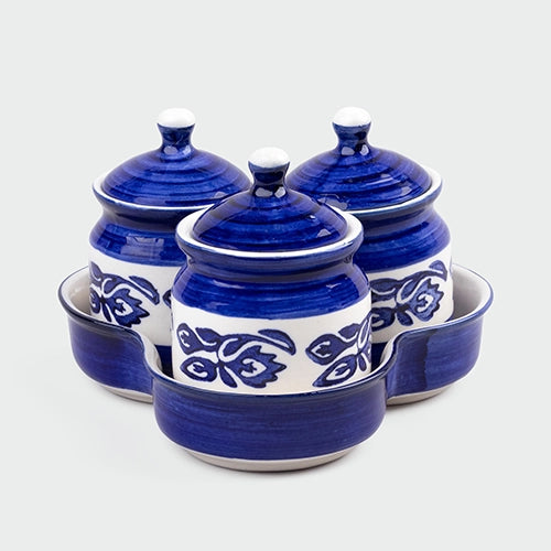 Elegant royal blue condiment jars with hand-painted details
