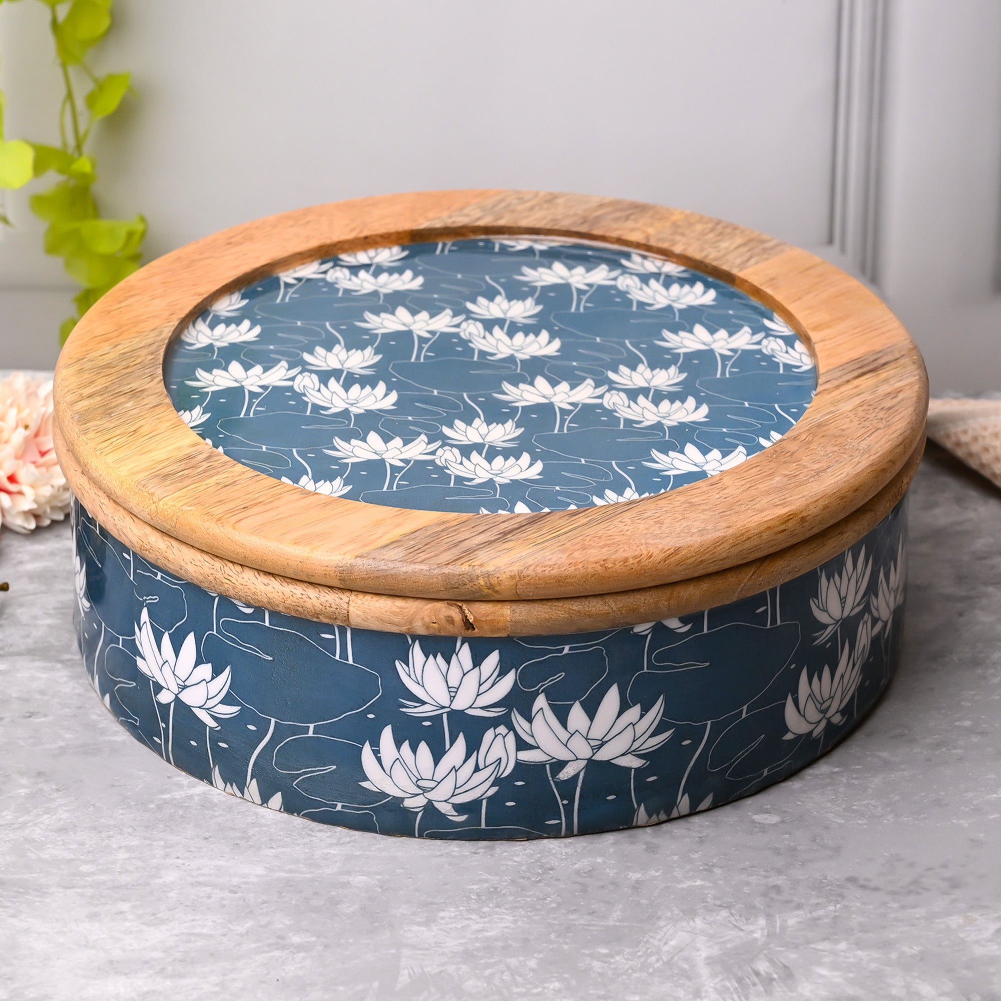 Handcrafted wooden casserole with sea-inspired floral artwork

