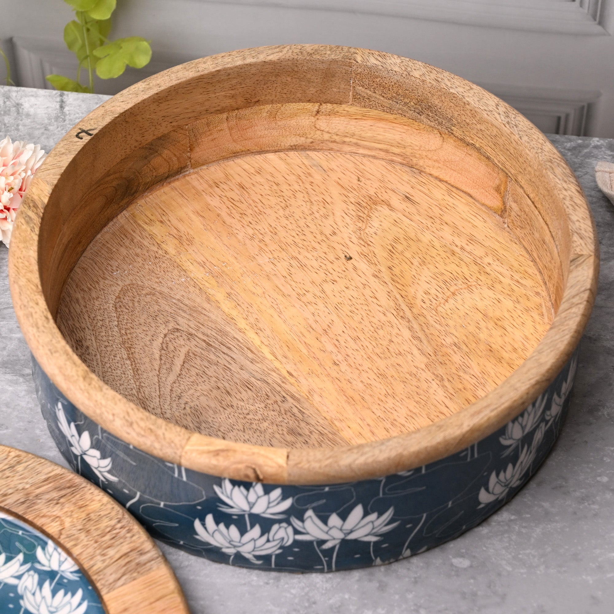 Elegant wooden casserole with beautiful floral detailing

