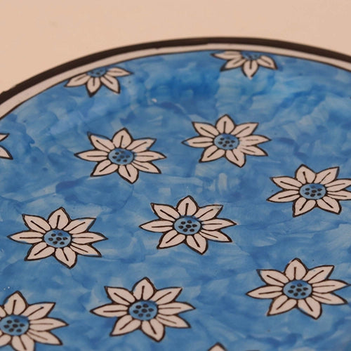 Sky blue ceramic platter with hand-painted floral design

