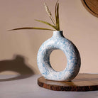 Sky blue donut ring vase with modern sculptural design

