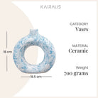 Minimalist sky blue donut-shaped vase with unique design

