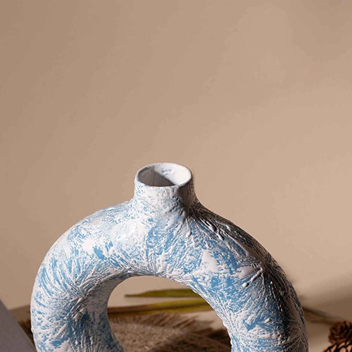 Decorative sky blue donut vase for stylish interiors

