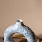 Decorative sky blue donut vase for stylish interiors

