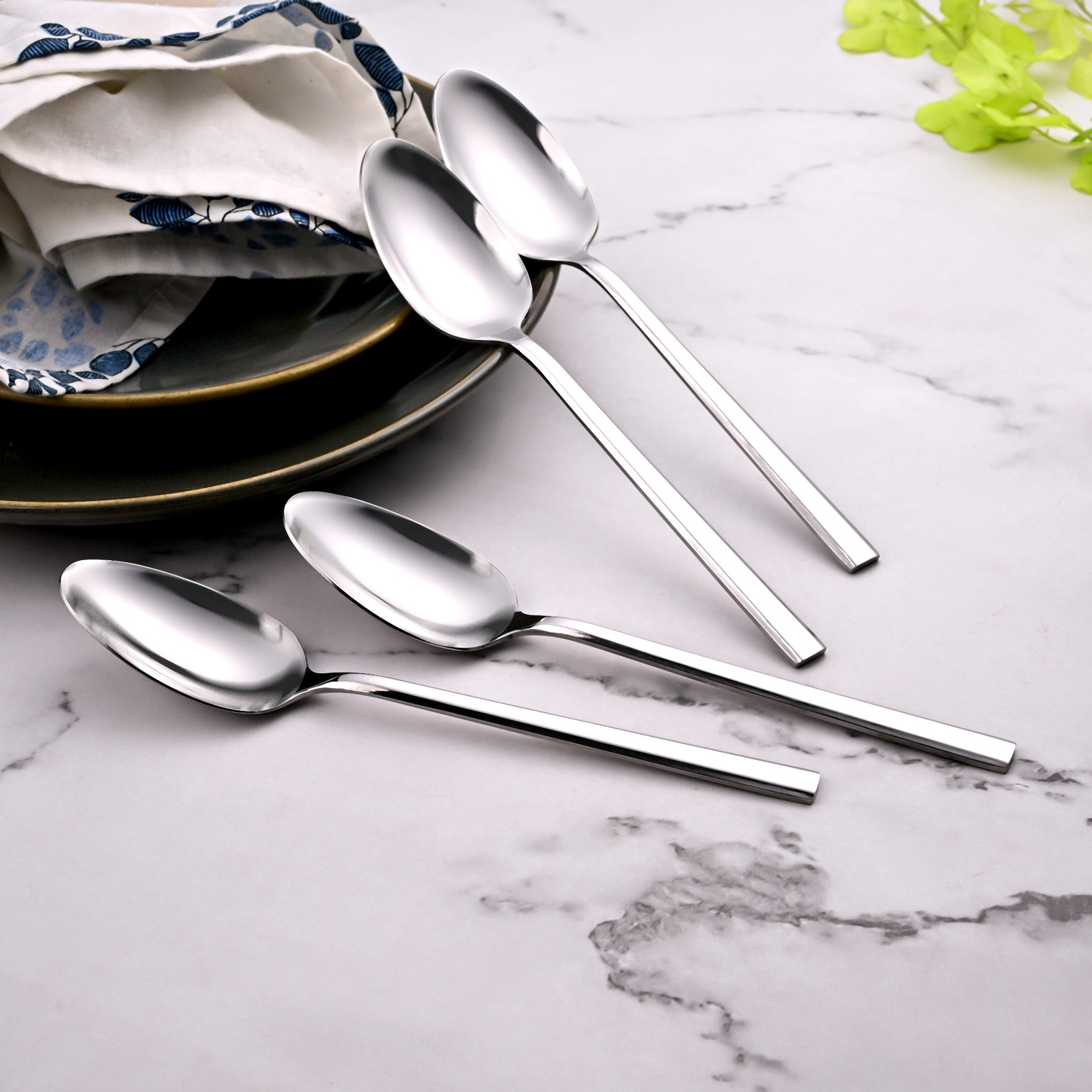 Stylish Sleekline Steel Spoons Displayed with Elegant Tableware

