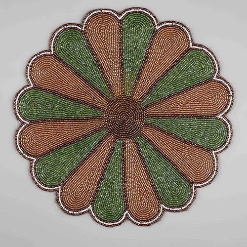 Green and white beaded table mat with starry design
