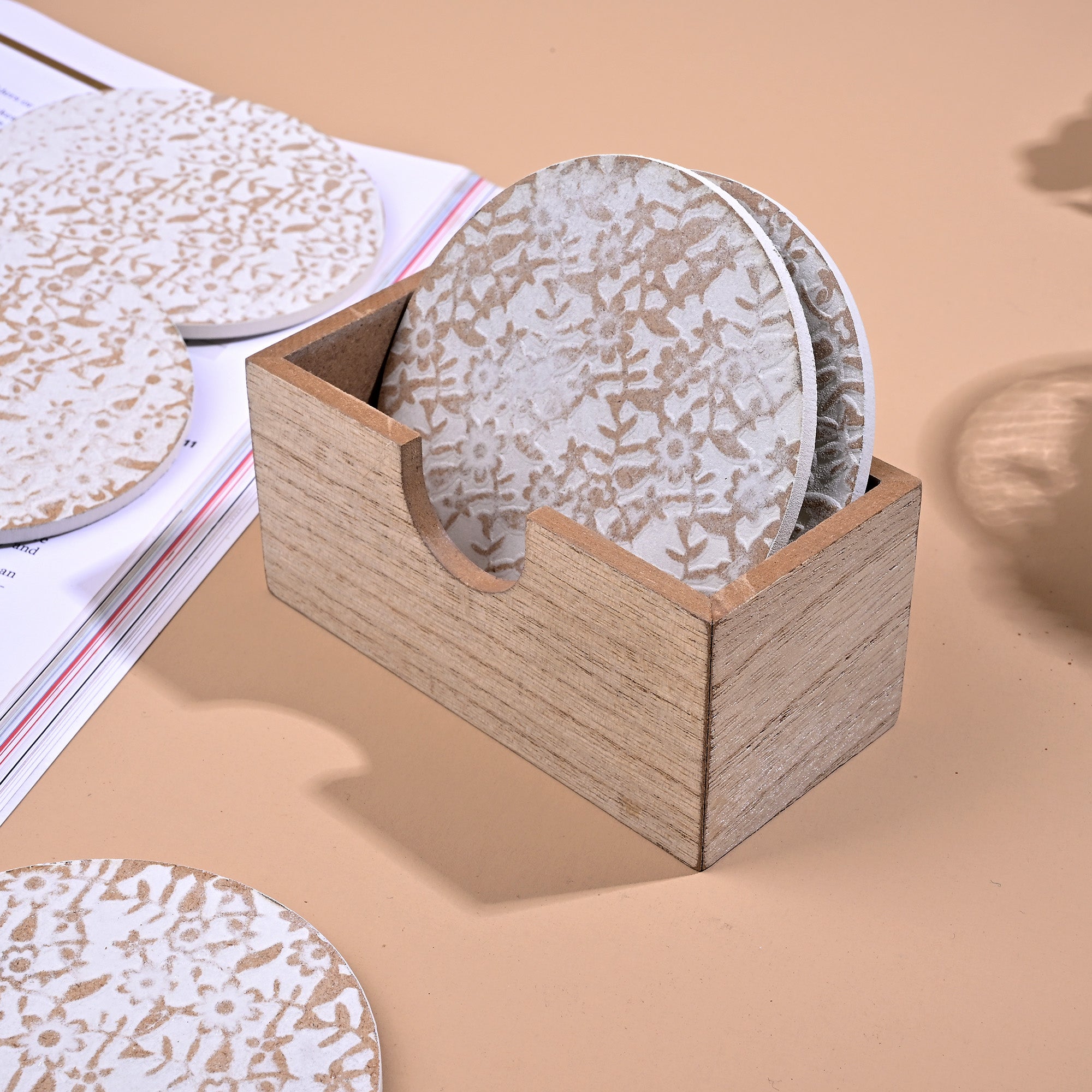 Gold and white wooden coasters arranged together

