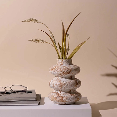 Taupe tri-ring ceramic vase with modern sculptural design


