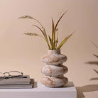 Taupe tri-ring ceramic vase with modern sculptural design

