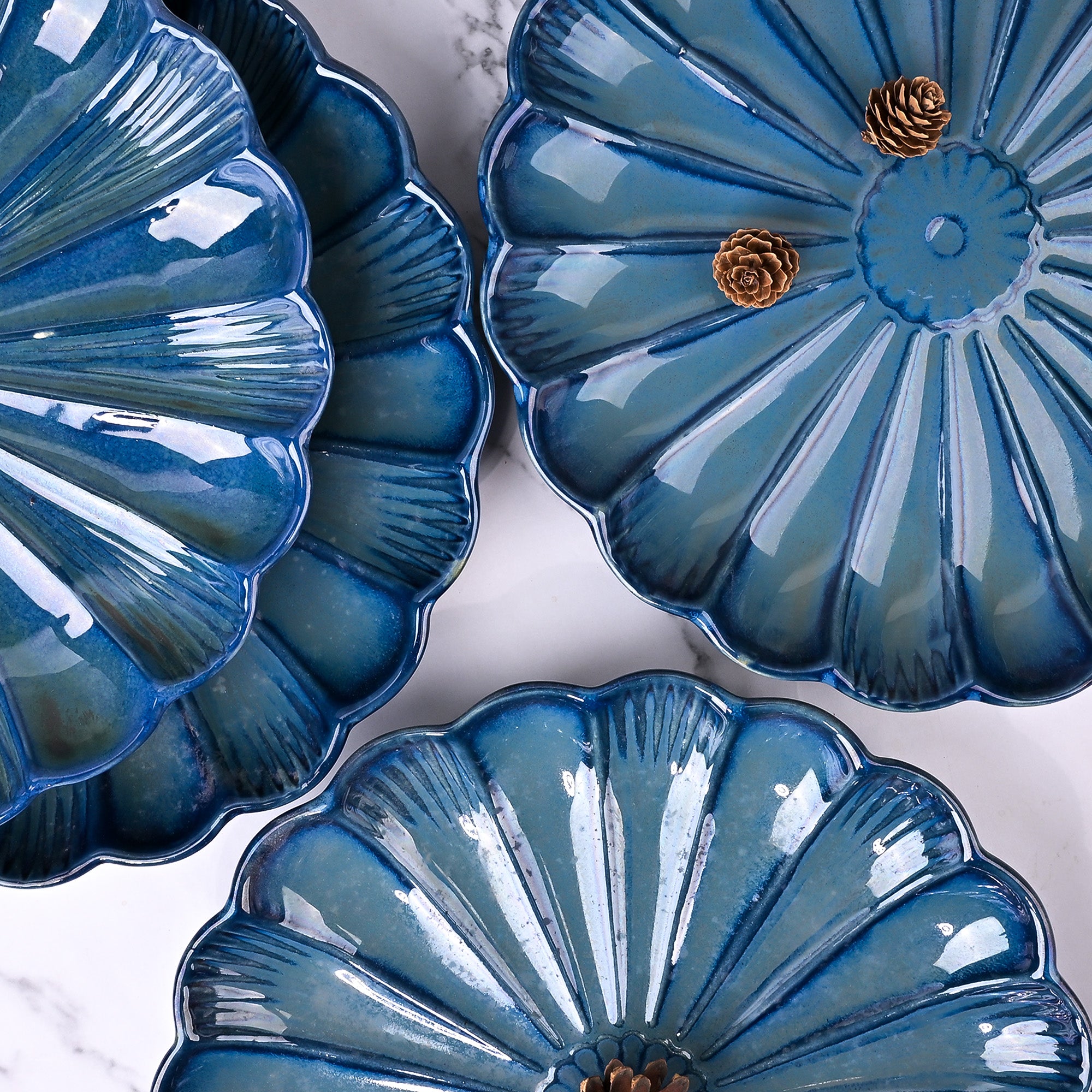 Set of 4 teal blue flower shaped ceramic plates

