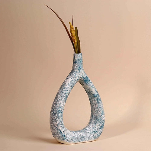 Teal textured triangle vase with modern sculptural design


