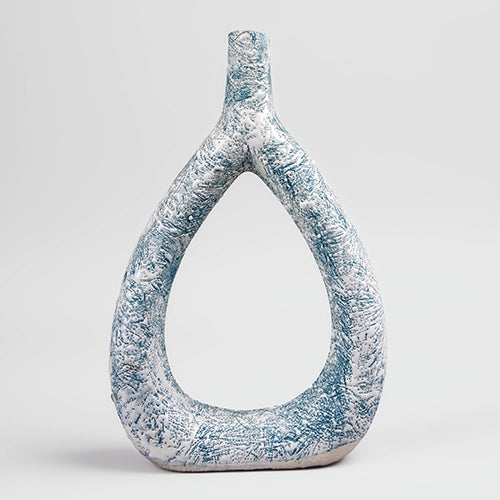 Elegant teal triangle vase featuring a textured finish

