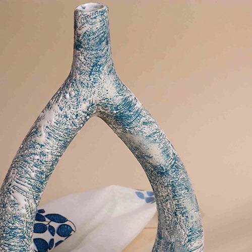 Sculptural triangle vase in a rich teal finish

