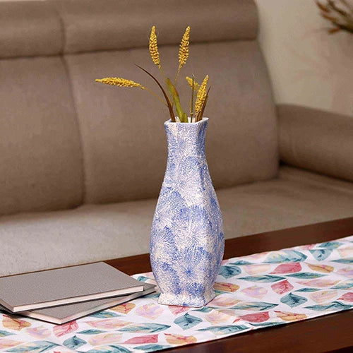 Textured blue flower vase with elegant decorative design

