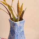Stylish textured vase in a rich blue finish

