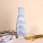Modern blue flower vase with artistic textured design

