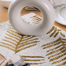 Luxury gold and white beaded table mat for Thanksgiving
