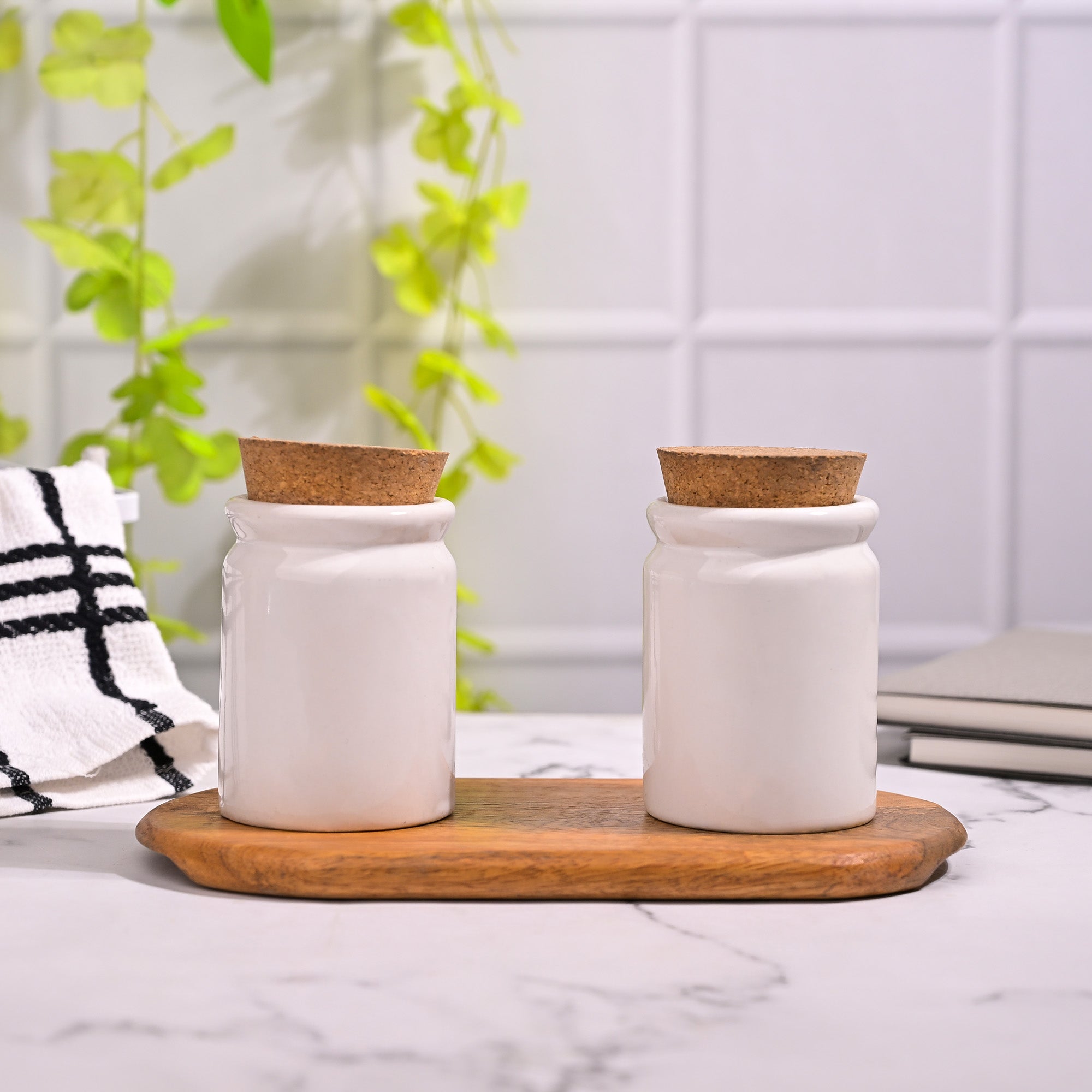 Ceramic kitchen storage jars set with matching lids
